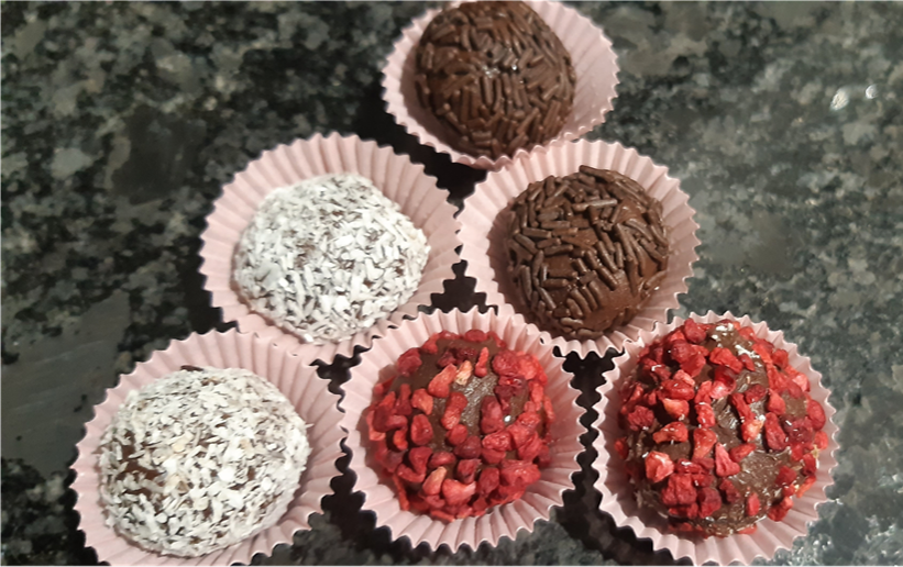 Six chocolate truffles with an assortment of coatings